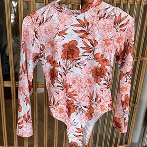 Size Small women’s long sleeve one piece rash guard SPF 50 NWOT